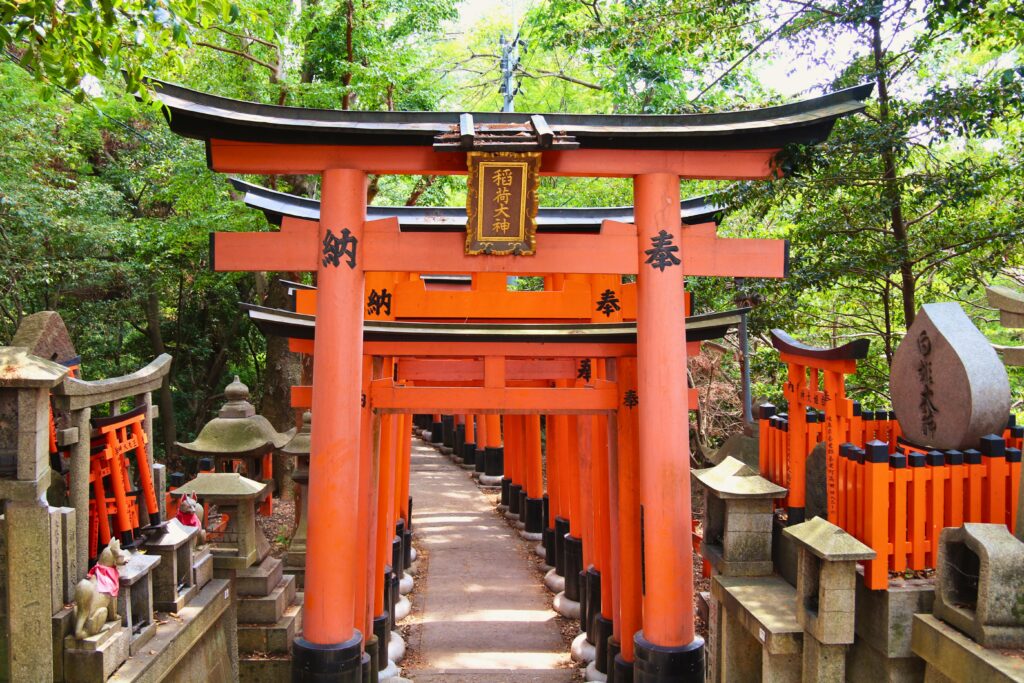 Explore the vibrant torii gates of Fushimi Inari Shrine in Kyoto, a serene and iconic landmark.